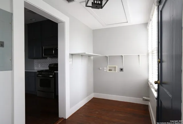 a view of a kitchen from the hallway
