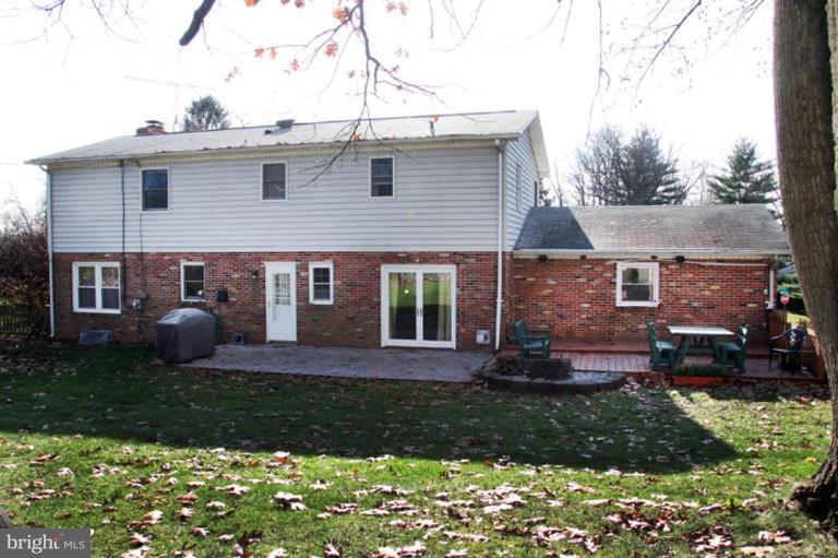 304 Bynum Ridge Road Forest Hill, MD 21050 - Photo 22 of 23 a front view of a house with a yard and outdoor seating