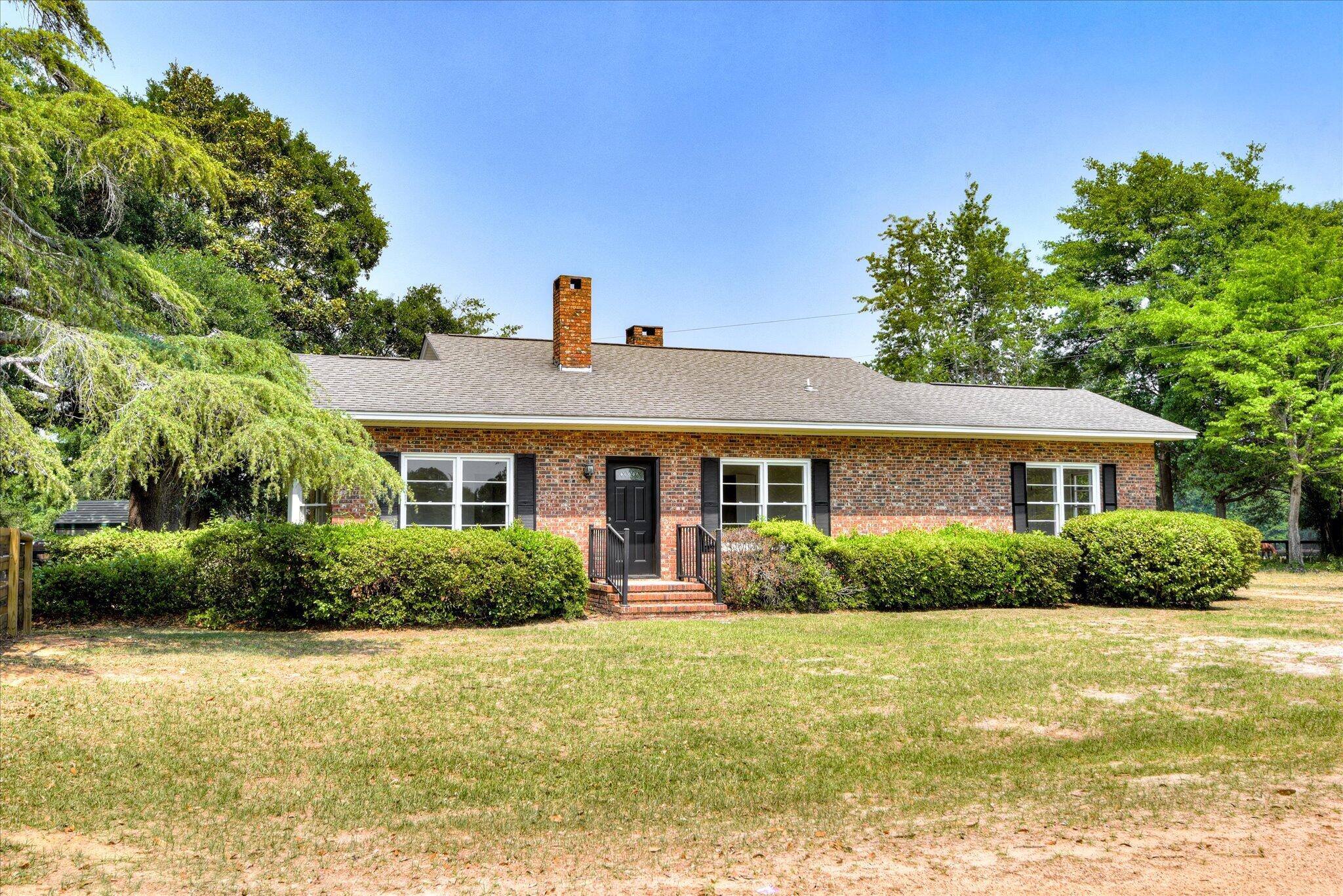 126 Mosley Road Aiken, SC 29801 - Photo 28 of 29 a front view of a house with a yard