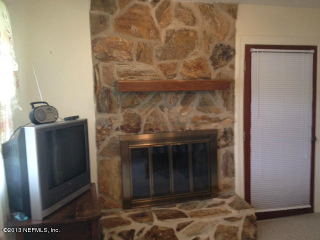 282 Round Lake Road Palatka, FL 32177 - Photo 15 of 29 fireplace in bedroom