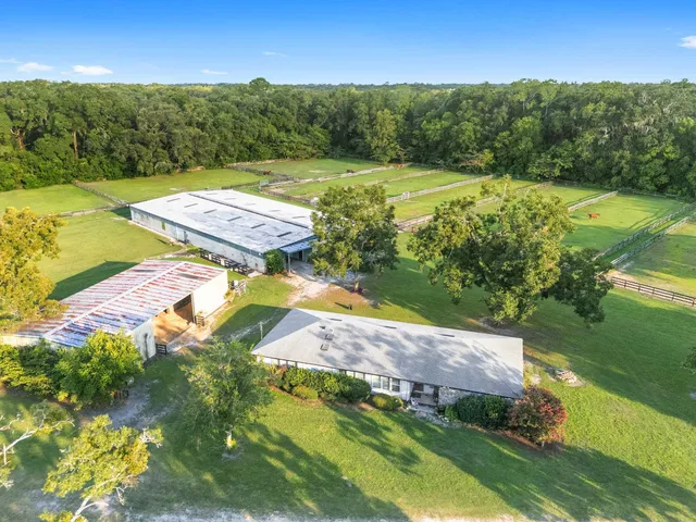 a aerial view of a house with a yard