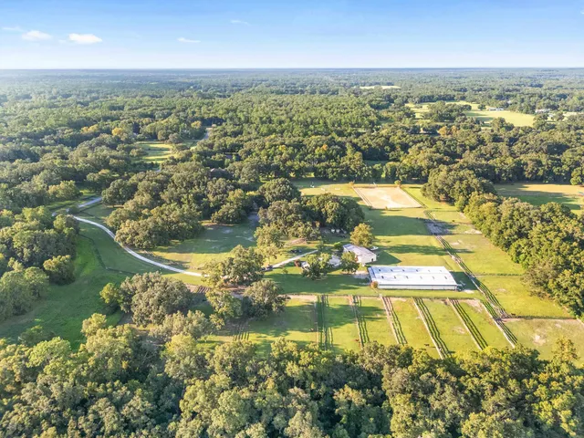 a front view of a house with a garden and porch
