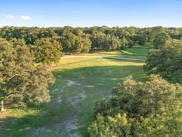 a bed sitting in a room next to a window