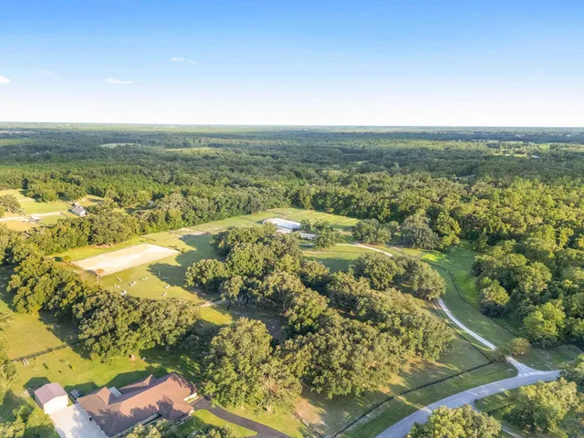 a view of a swimming pool with a yard