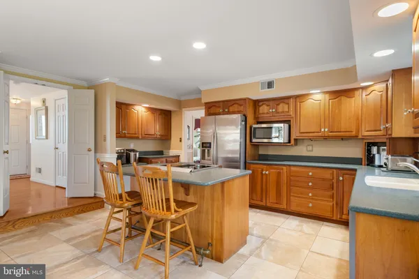 a dining room with furniture window and wooden floor