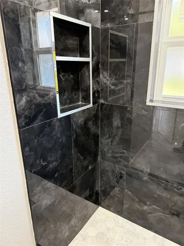 a bathroom with a small window