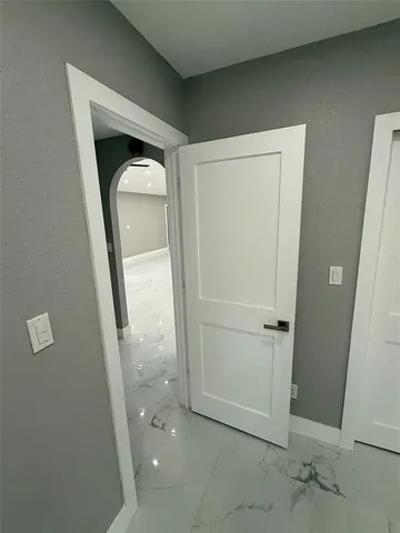 an empty room with mirror