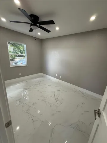 a view of an empty room with a window