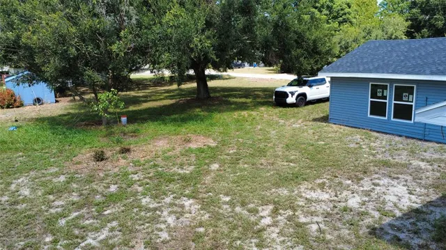 a view of a back yard of the house