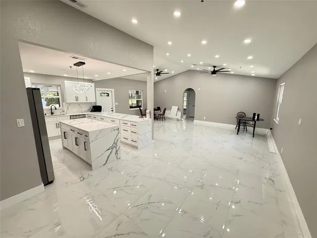 a large room with lot of table and chairs