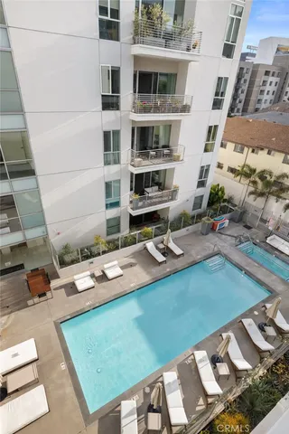 a kitchen with sink a stove and chairs