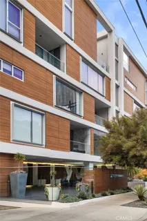 a view of kitchen with furniture and wooden floor