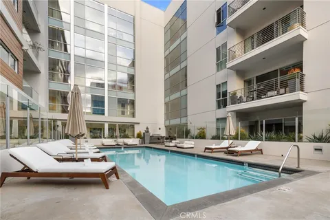 a kitchen with stainless steel appliances a refrigerator and a stove