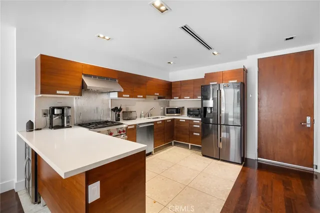 a view of a bedroom with washer and dryer