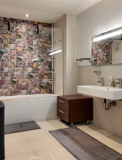 a bathroom with a sink a toilet and a bathtub