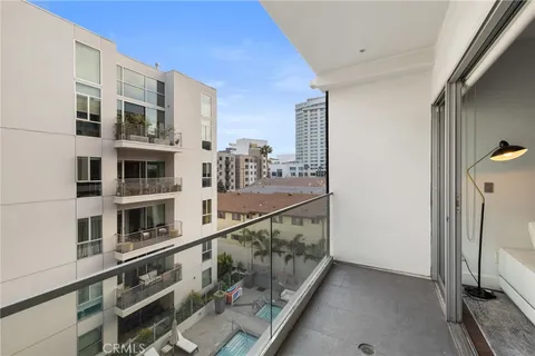 a view of a building with sitting area