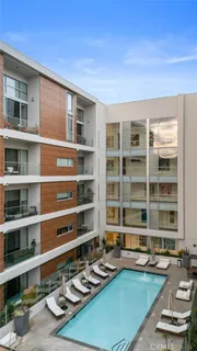 a view of swimming pool with outdoor seating