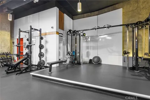 a view of parking garage with cars parked