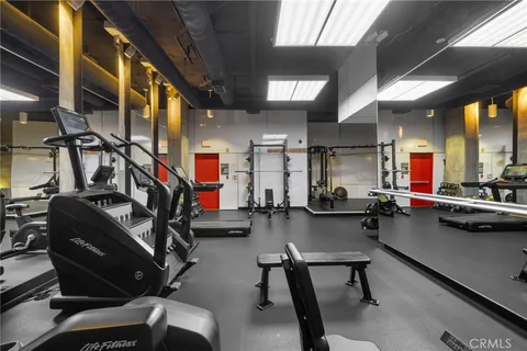 a front view of multi story building with retail shops