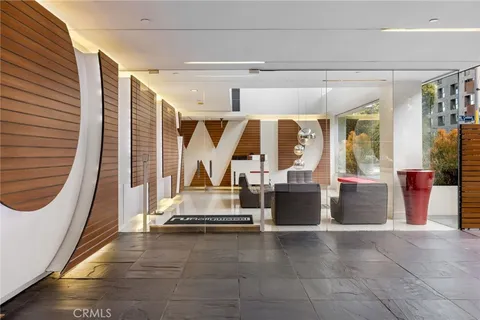 a living room with furniture chandelier and a chandelier