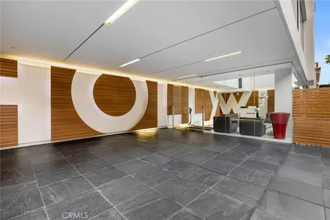 a lobby with furniture and window