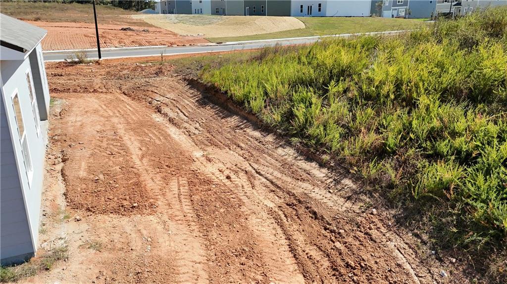 132 Galilee Lane Bethlehem, GA 30620 - Photo 4 of 13 a view of a yard with wooden fence