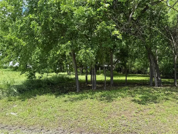 a fire hydrant in the middle of a field