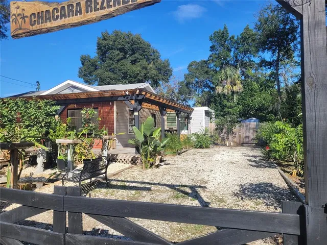 a front view of a house with yard and seating area