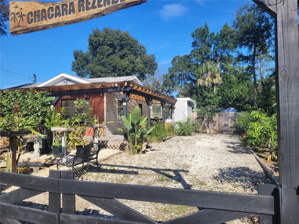 a front view of a house with yard and seating area