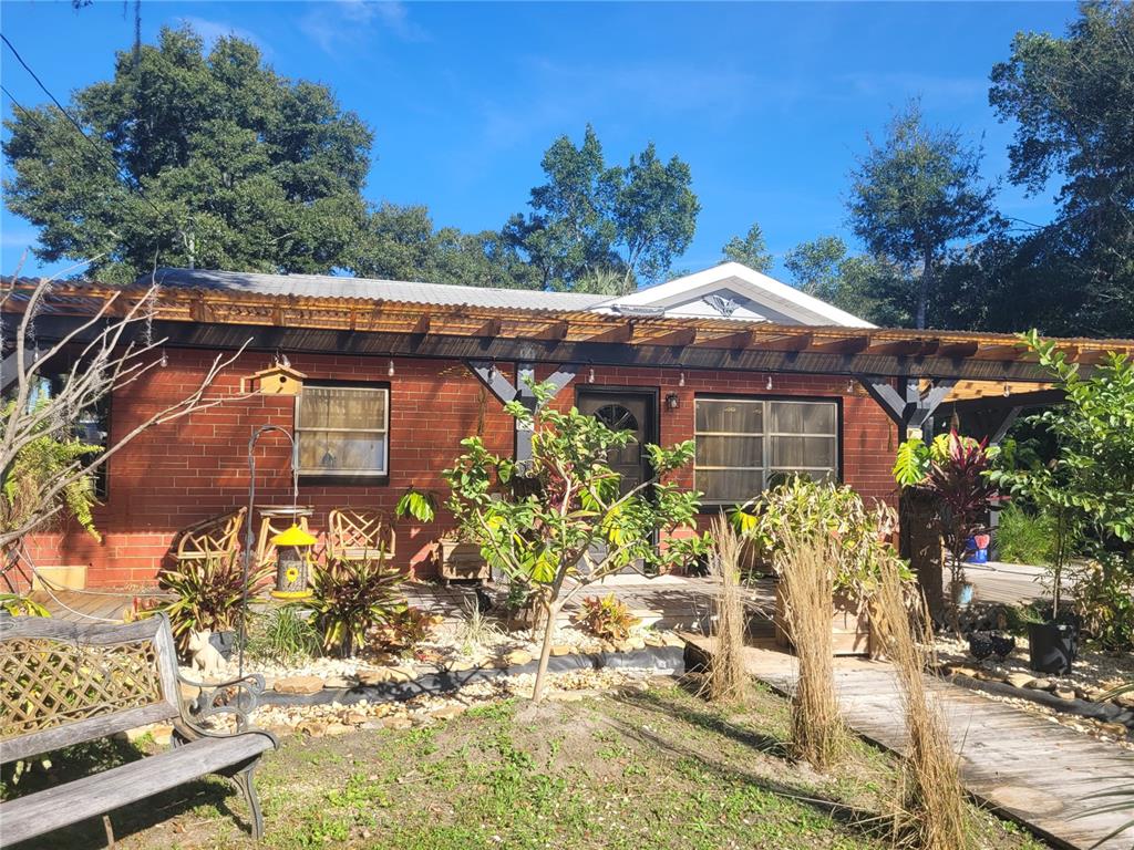 821 South Honey Way Inverness, FL 34450 - Photo 2 of 38 a front view of a house with a yard