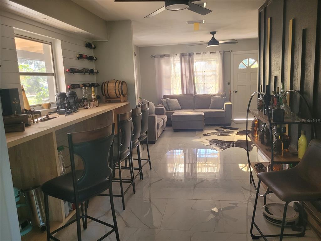 821 South Honey Way Inverness, FL 34450 - Photo 22 of 38 a living room with furniture and a large window
