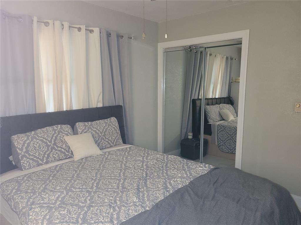 821 South Honey Way Inverness, FL 34450 - Photo 23 of 38 a bedroom with a bed and a window