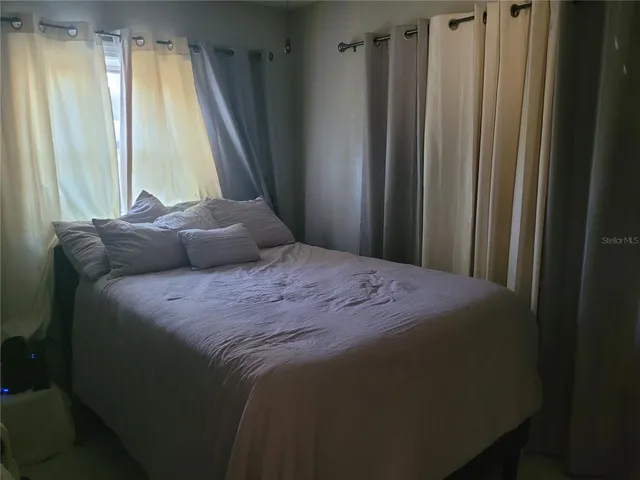 a store room with lots of different colored cloths