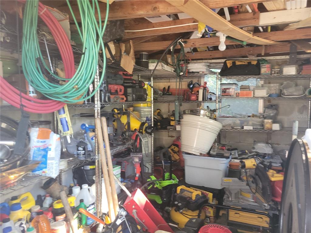 821 South Honey Way Inverness, FL 34450 - Photo 25 of 38 a store room with lots of different colored cloths