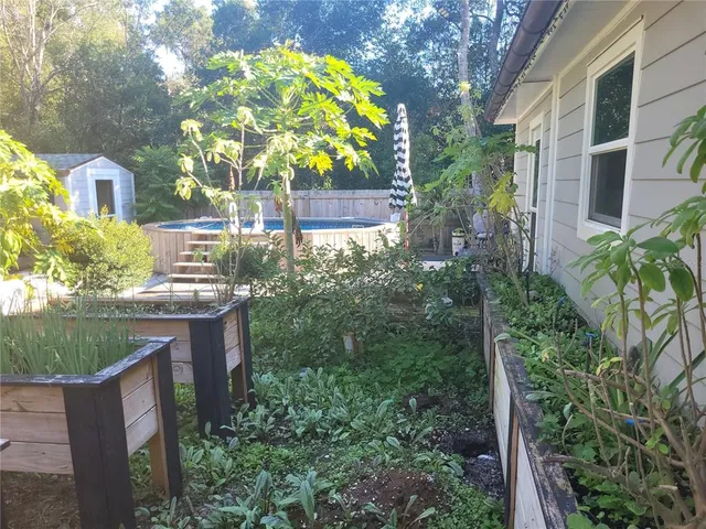 a view of a swimming pool with a patio