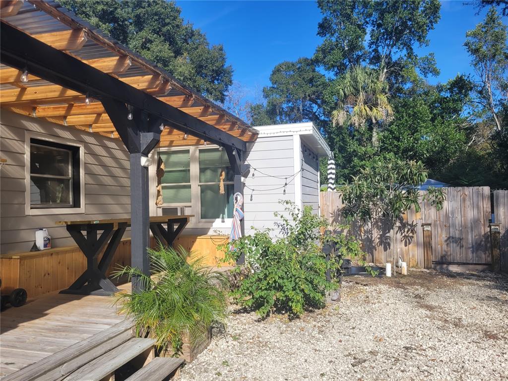 821 South Honey Way Inverness, FL 34450 - Photo 8 of 38 a view of a house with backyard and sitting area