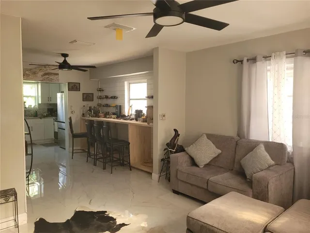 a living room with furniture and a window