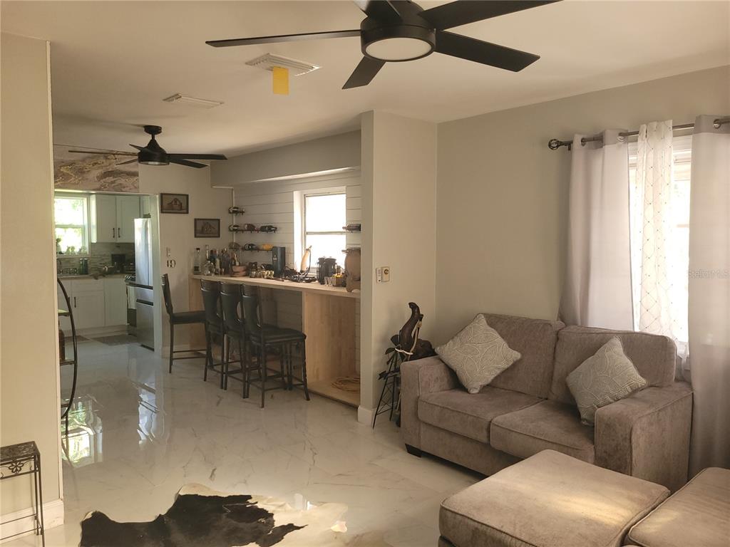 821 South Honey Way Inverness, FL 34450 - Photo 9 of 38 a living room with furniture and a window