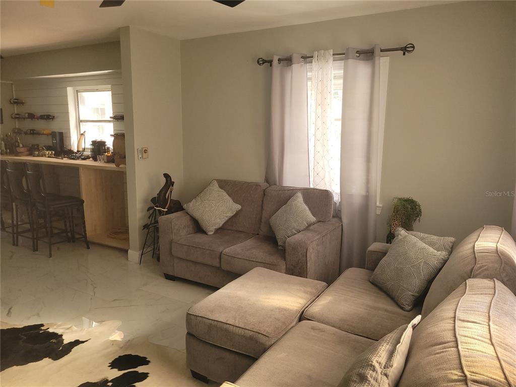 821 South Honey Way Inverness, FL 34450 - Photo 10 of 38 a living room with furniture and a window