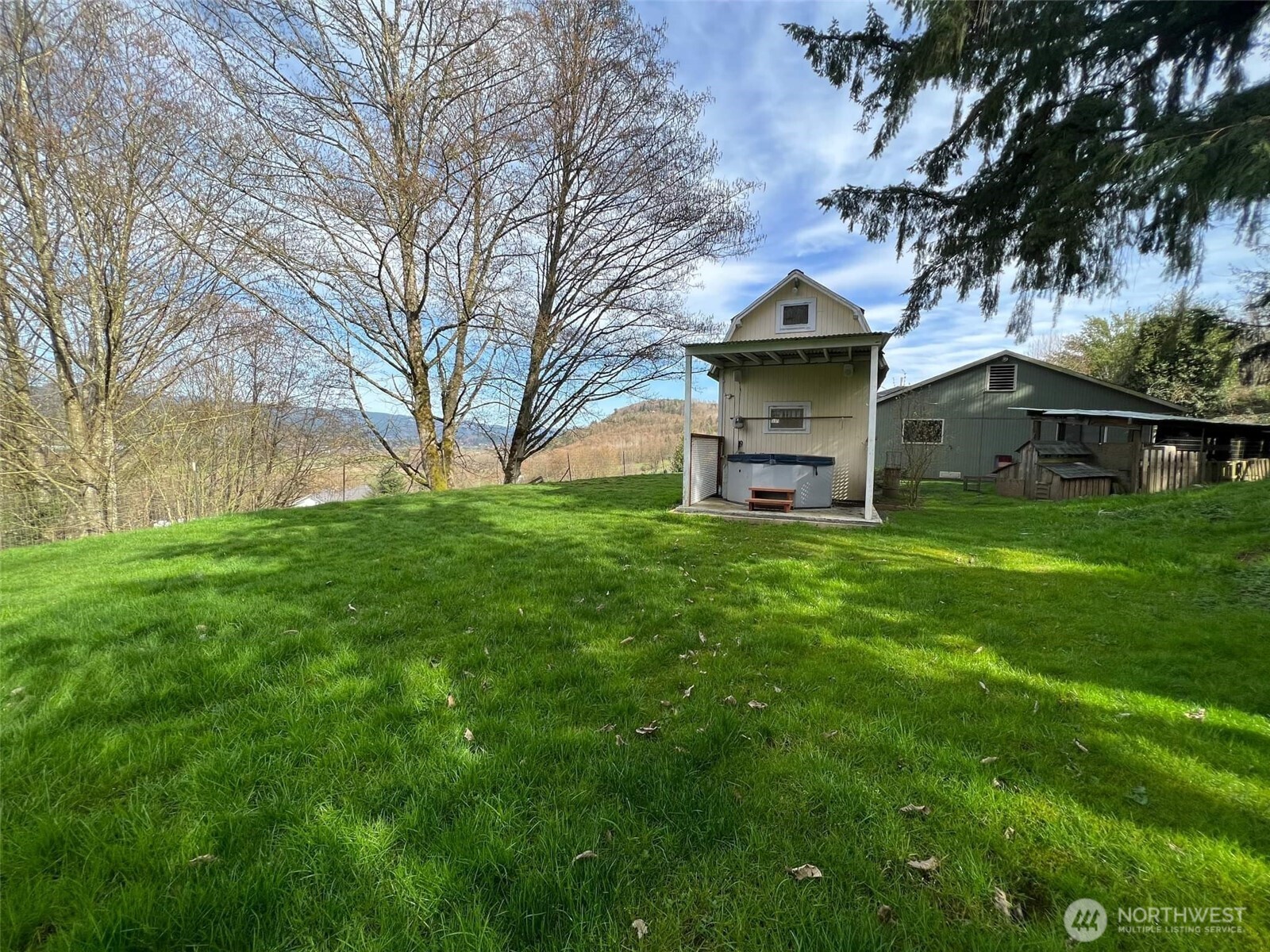 278 Wilson Road Mossyrock, WA 98564 - Photo 12 of 33 a large house with a big yard and potted plants and large tree