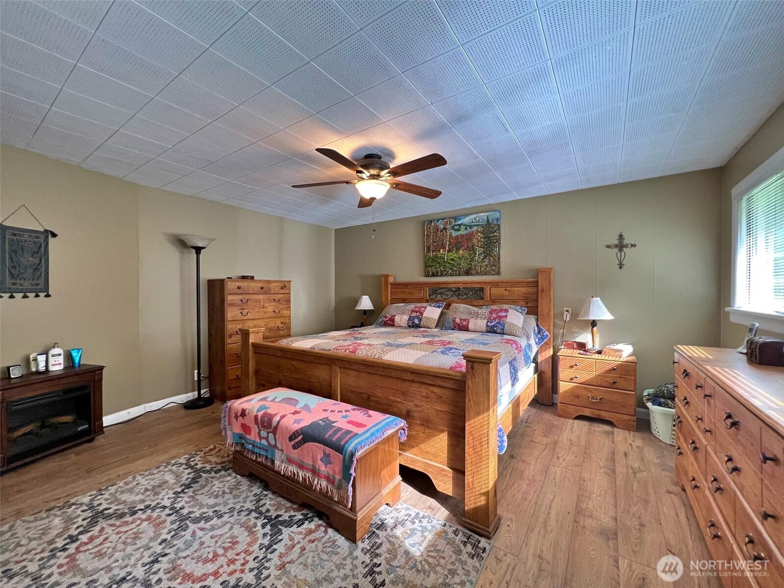 278 Wilson Road Mossyrock, WA 98564 - Photo 16 of 33 a bedroom with a bed and a chandelier