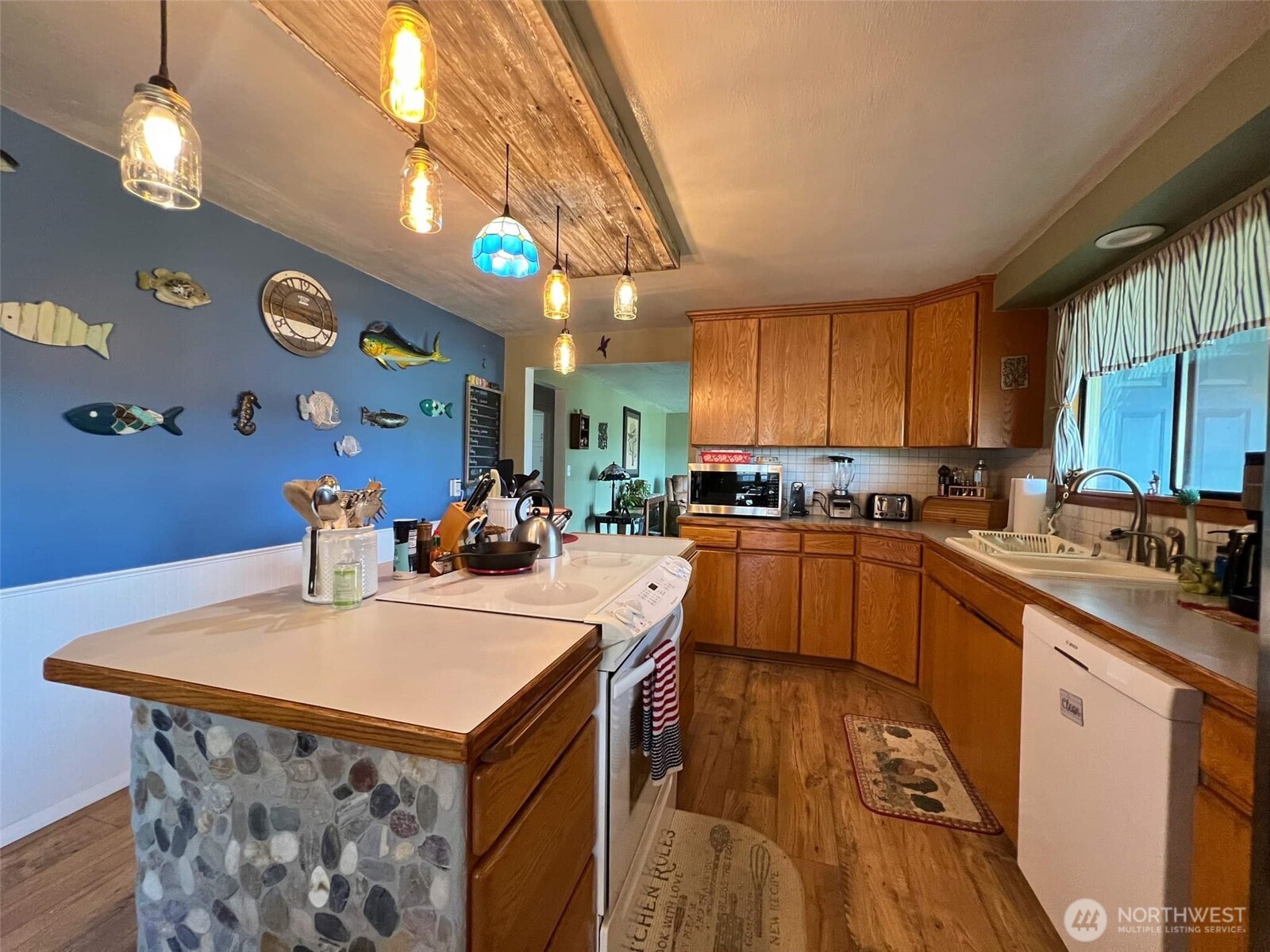 278 Wilson Road Mossyrock, WA 98564 - Photo 26 of 33 a kitchen with a sink a counter top space cabinets and stainless steel appliances