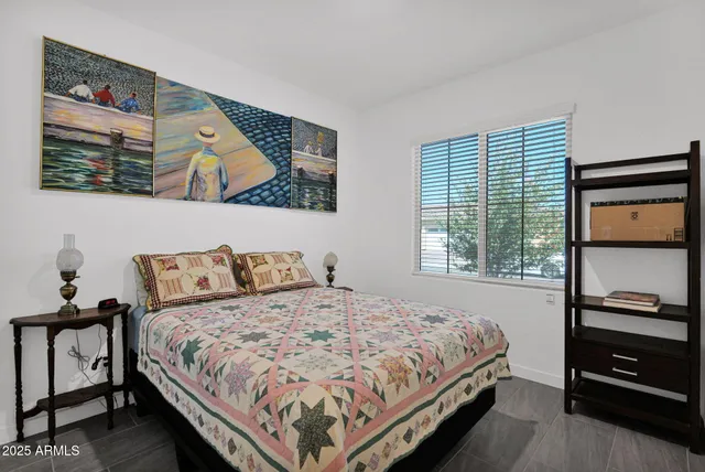 a bedroom with a bed and a window