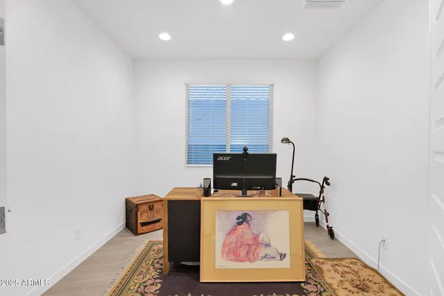 a room with furniture and flat screen