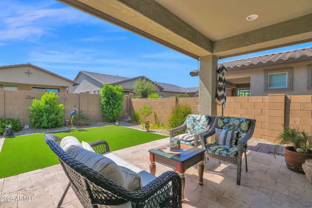 a view of an chairs and table in the patio