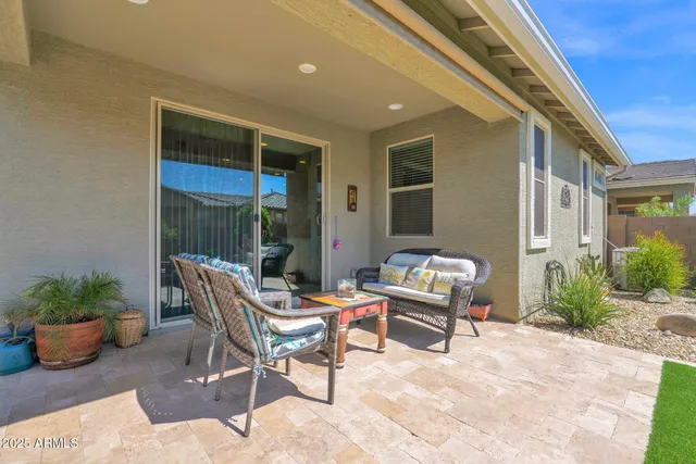 a outdoor space with a couch and chairs