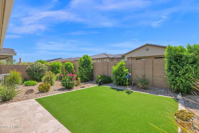 a view of a large garden with plants and large trees
