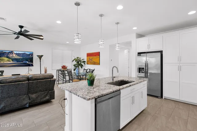 a kitchen with granite countertop living room and living room