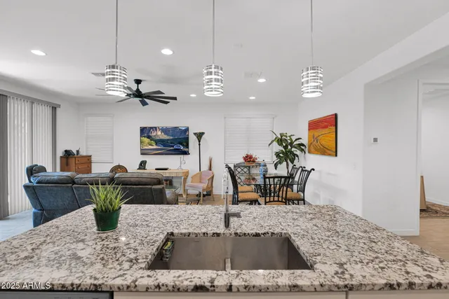a living room with fireplace furniture and a wooden floor