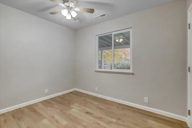 a bedroom with a bed a couch and dresser